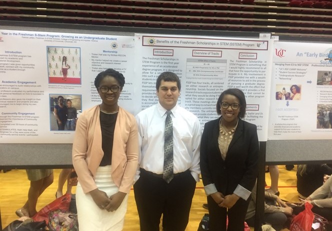 Freshman S-STEM scholars - Cancino, Hood and Ladipo presenting their posters